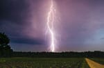 Lightning Striking A Field Of Crops